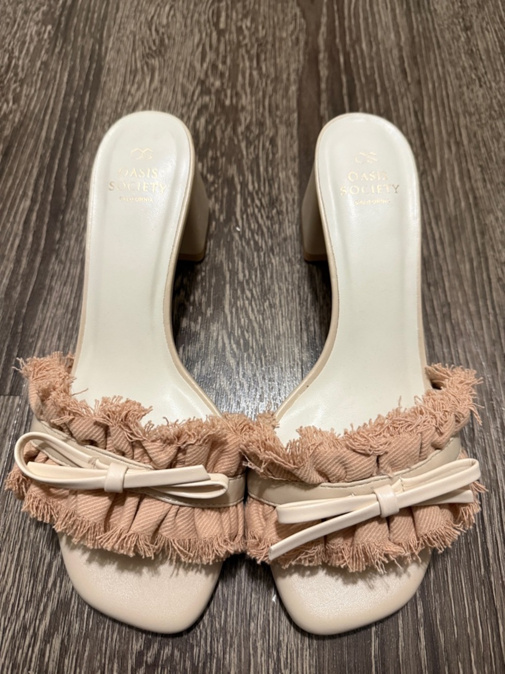Oasis Society Cream Slide Mules with Blush Fringed Bow